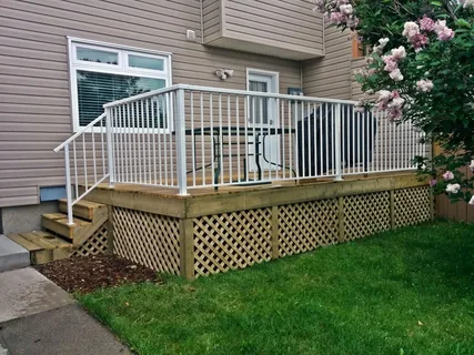 Wooden backyard deck designed by a professional deck company Calgary residents hire for outdoor renovations.