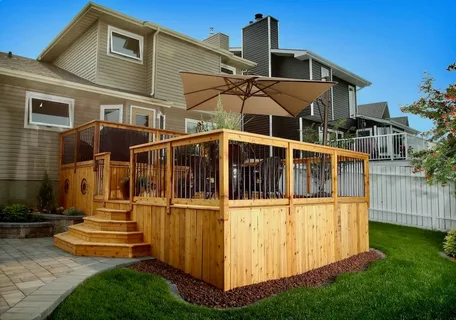Wooden backyard deck designed by a professional deck company Calgary residents hire for outdoor renovations.