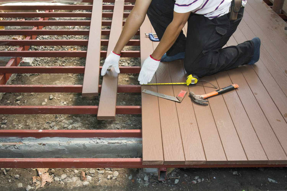 Professional deck contractors in Calgary building a custom outdoor deck with high-quality materials by Friendly Earth